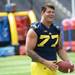 Michigan offensive linesman Taylor Lewan smiles while on the field during media day at Michigan Stadium on Sunday, August 11, 2013. Melanie Maxwell | AnnArbor.com